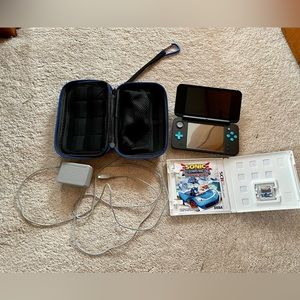 Nintendo 2DS XL, blue/teal, like new, with MarioKart preinstalled.